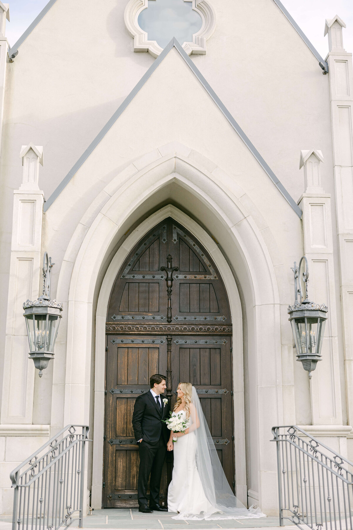 bride and groom out front of park chateau estate and gardens