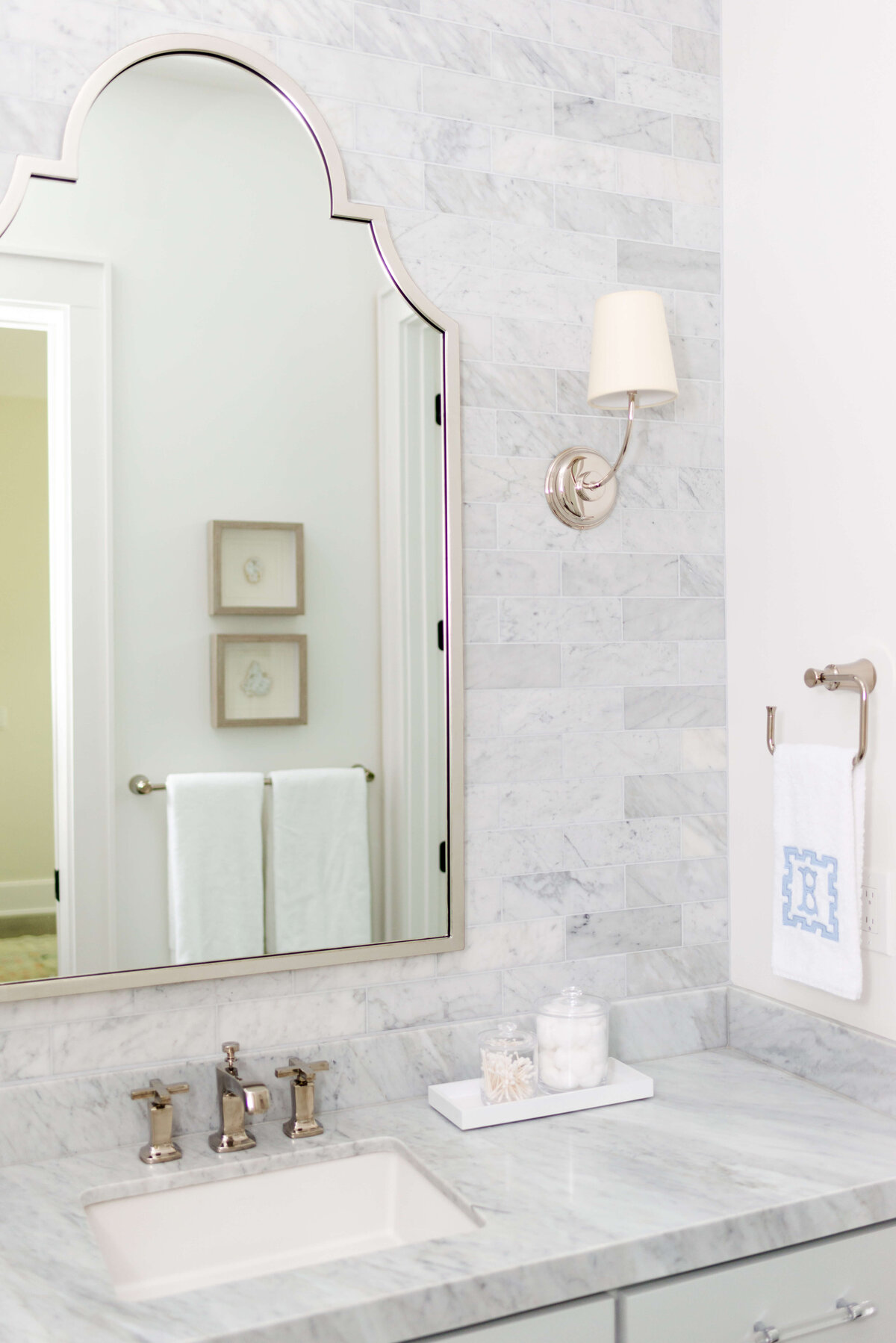 oyster creek studios building belt new build gray tile walls and marble counters in bathroom
