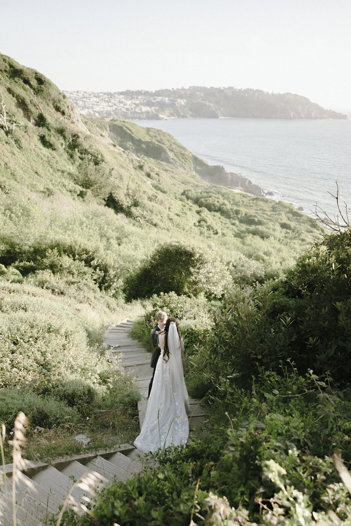 Bride and Groom at Marshall's Beach in San Francisco, California at sunset