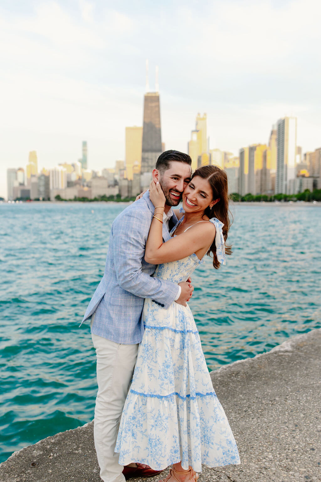 An engagement photography session at The Wrigley Building and North Ave Beach in Chicago, Illinois - 32