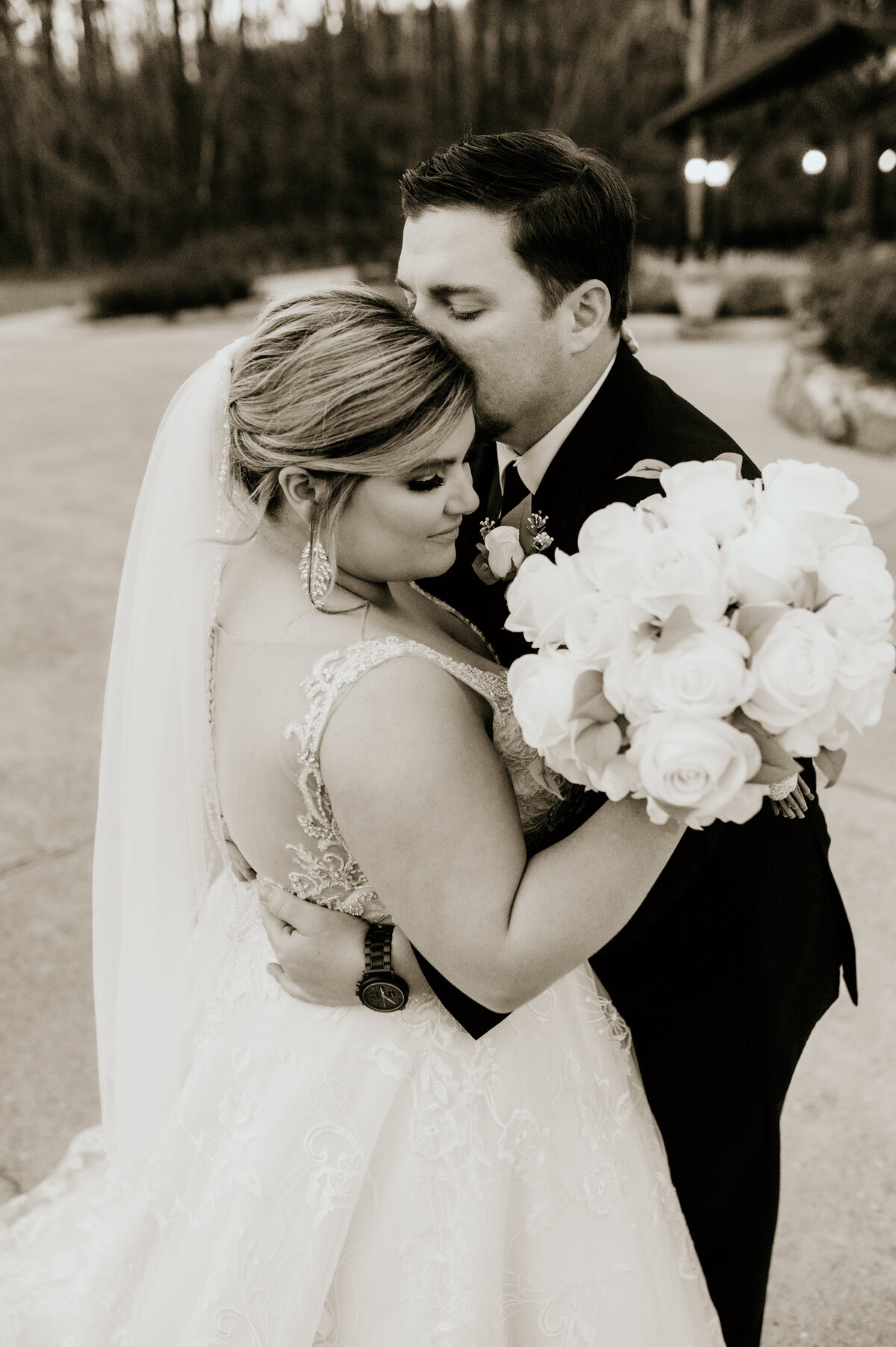 Little Rock wedding photographer captured bride and groom embracing outside of their wedding venue