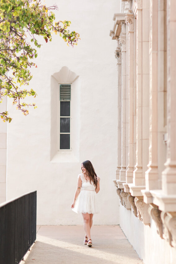 senior girl walkiing by Museum of Art Balboa Park San Diego