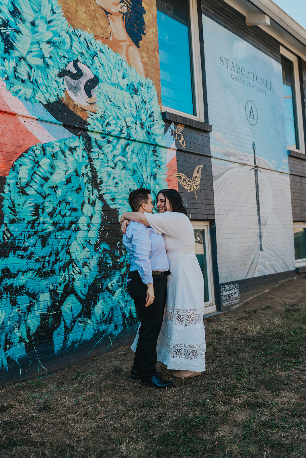 A couple embraces outside of record store in Nashville Tennessee