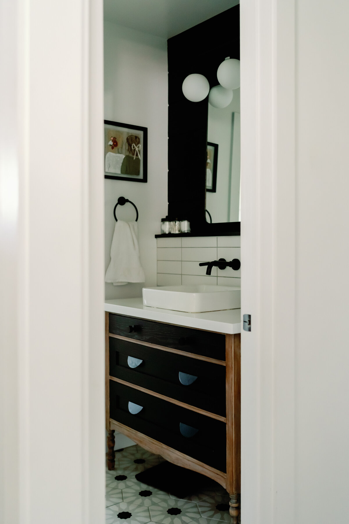 dresser turned into vanity with above counter sink and black faucet