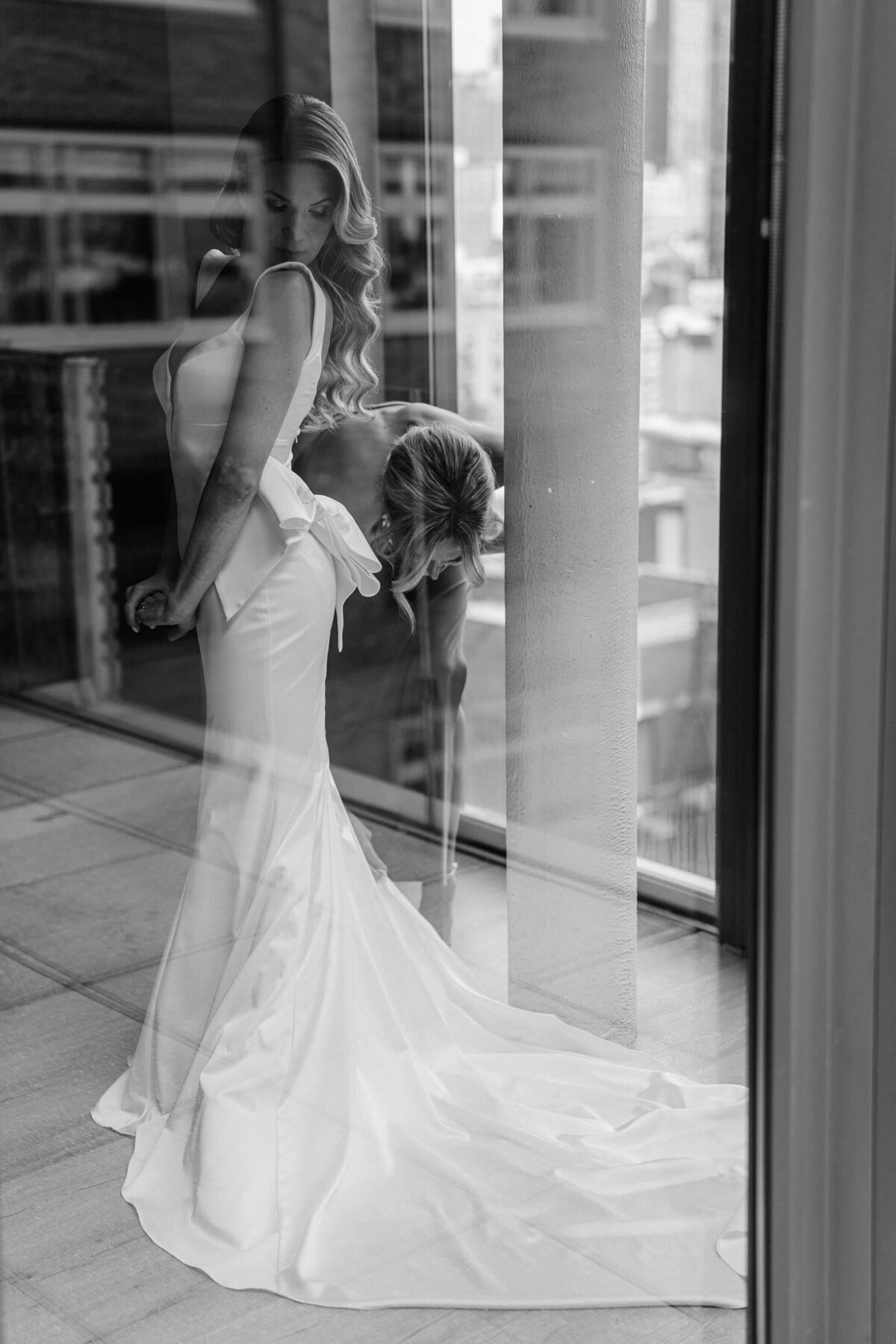 Black and white image of a bride getting ready