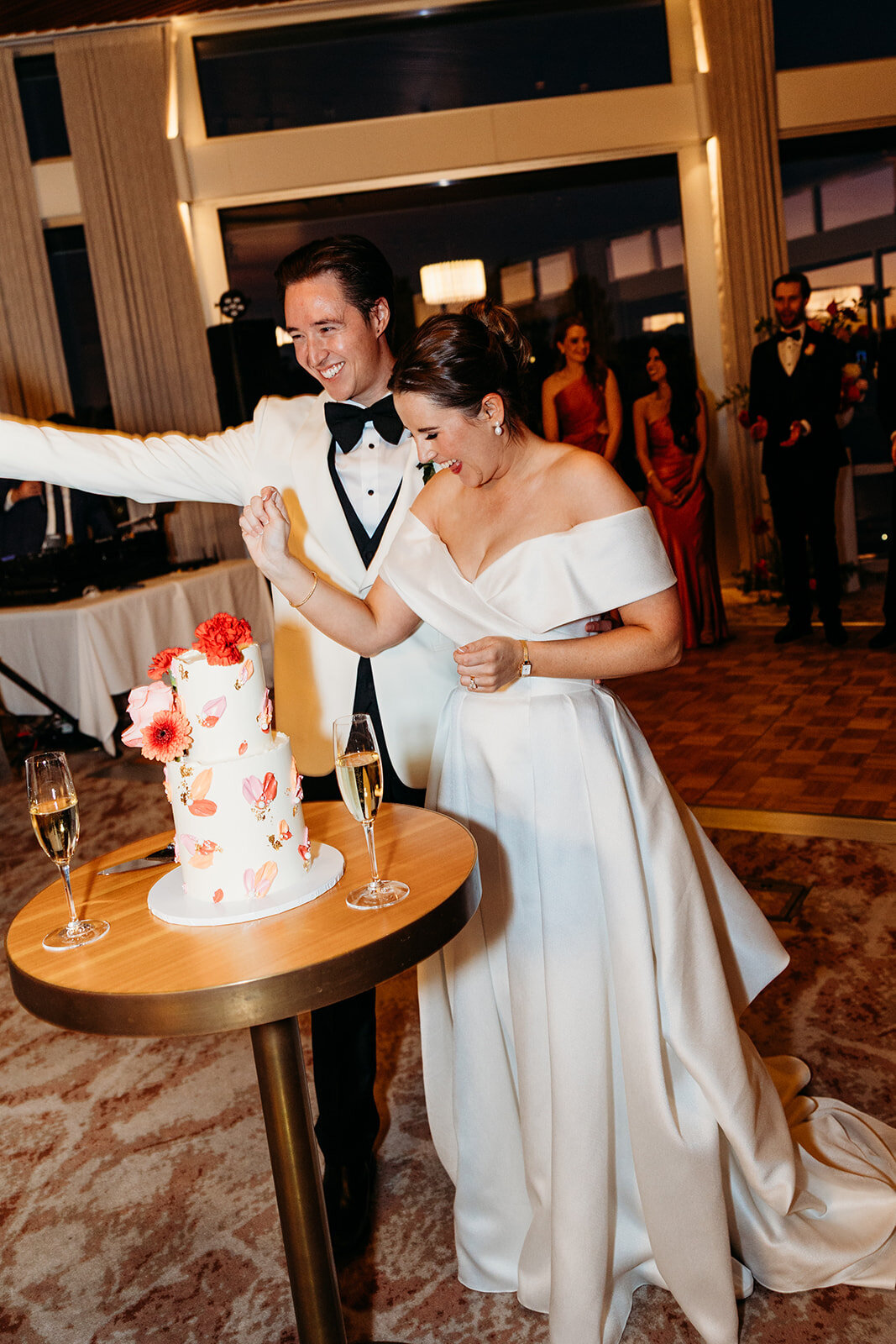 Bride and groom cut their wedding cake