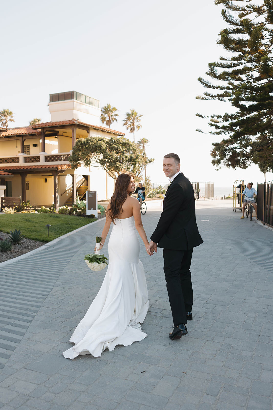 Bride and groom on a sunny street