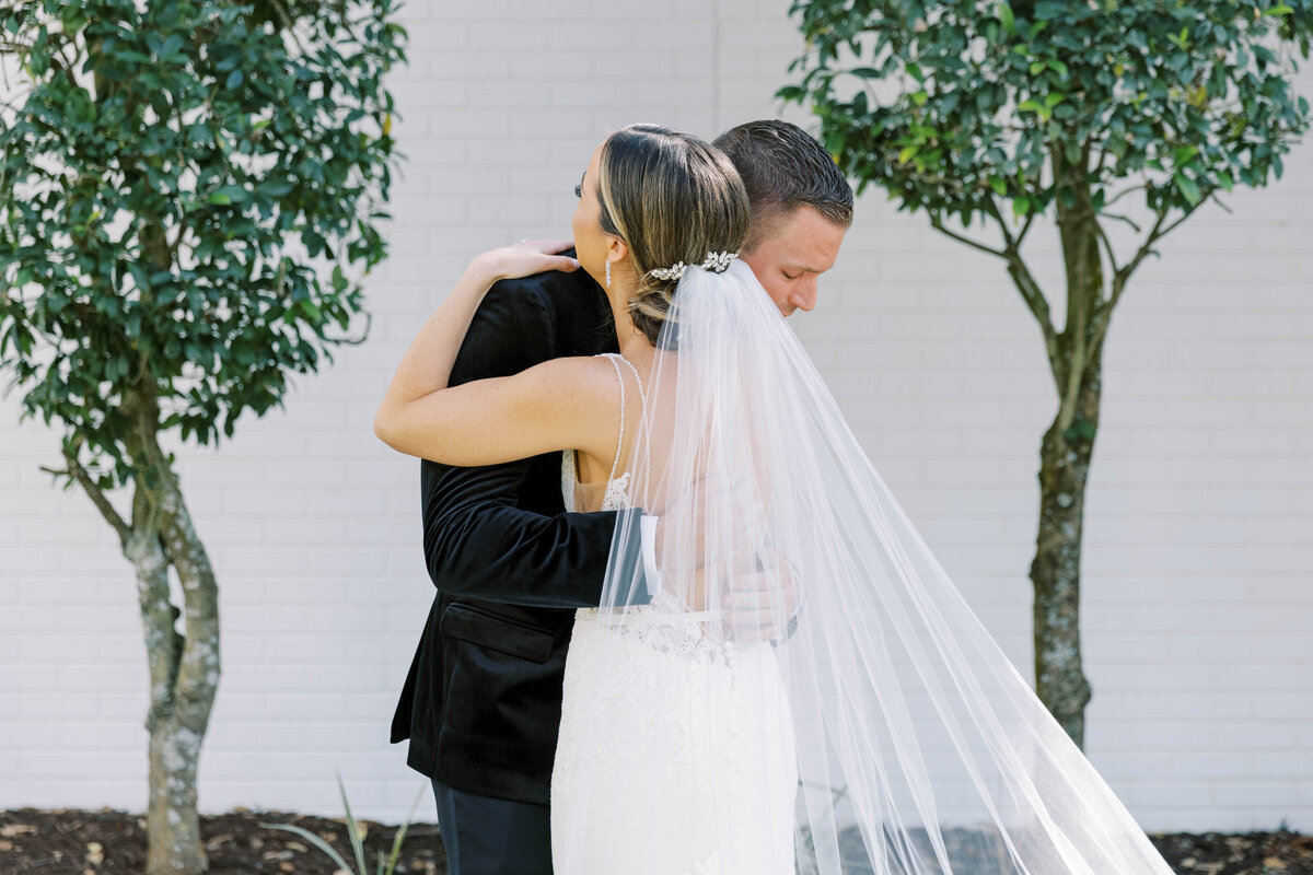 Bride and groom hugging eachother