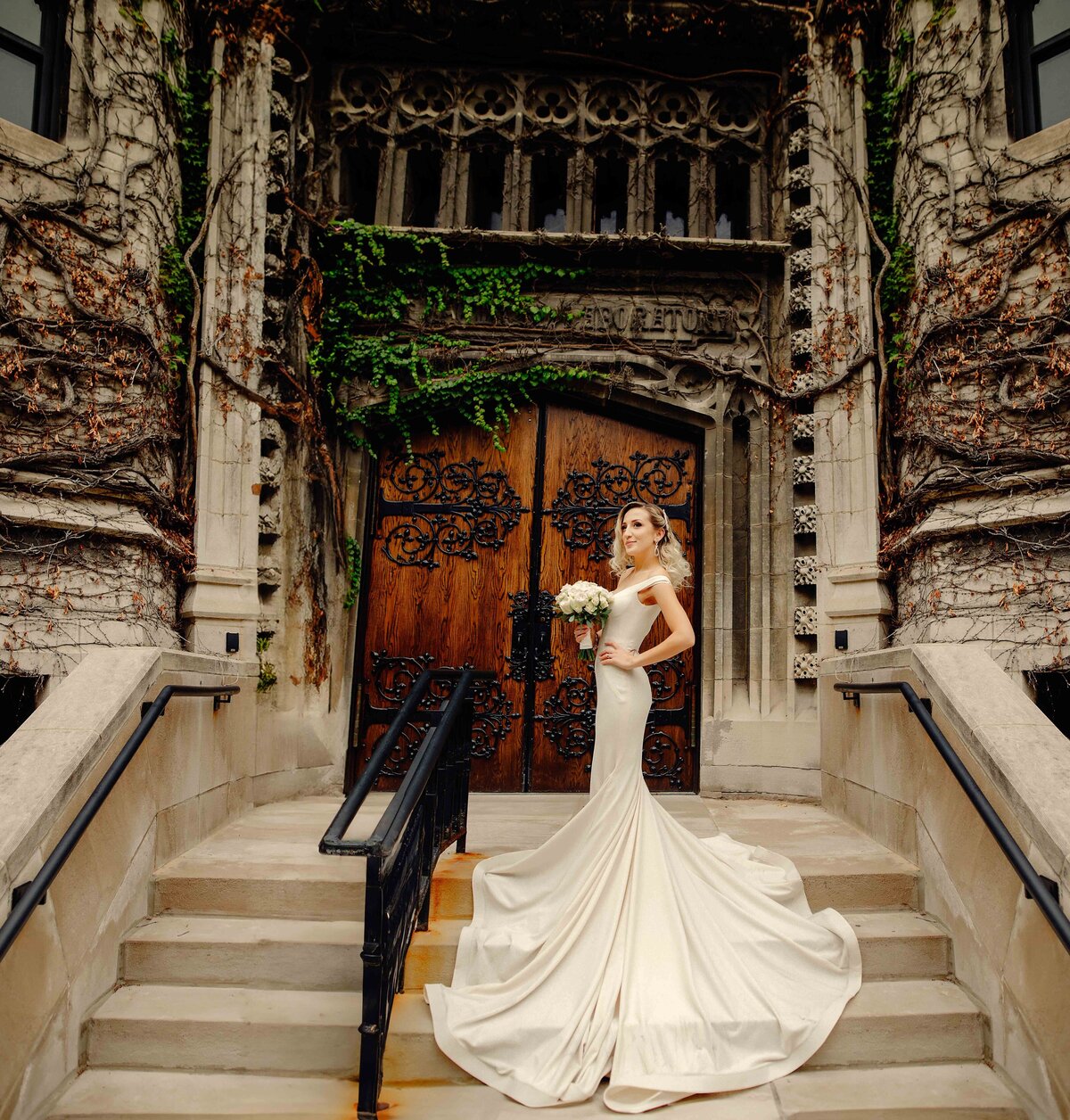 bride standing on steps at old church