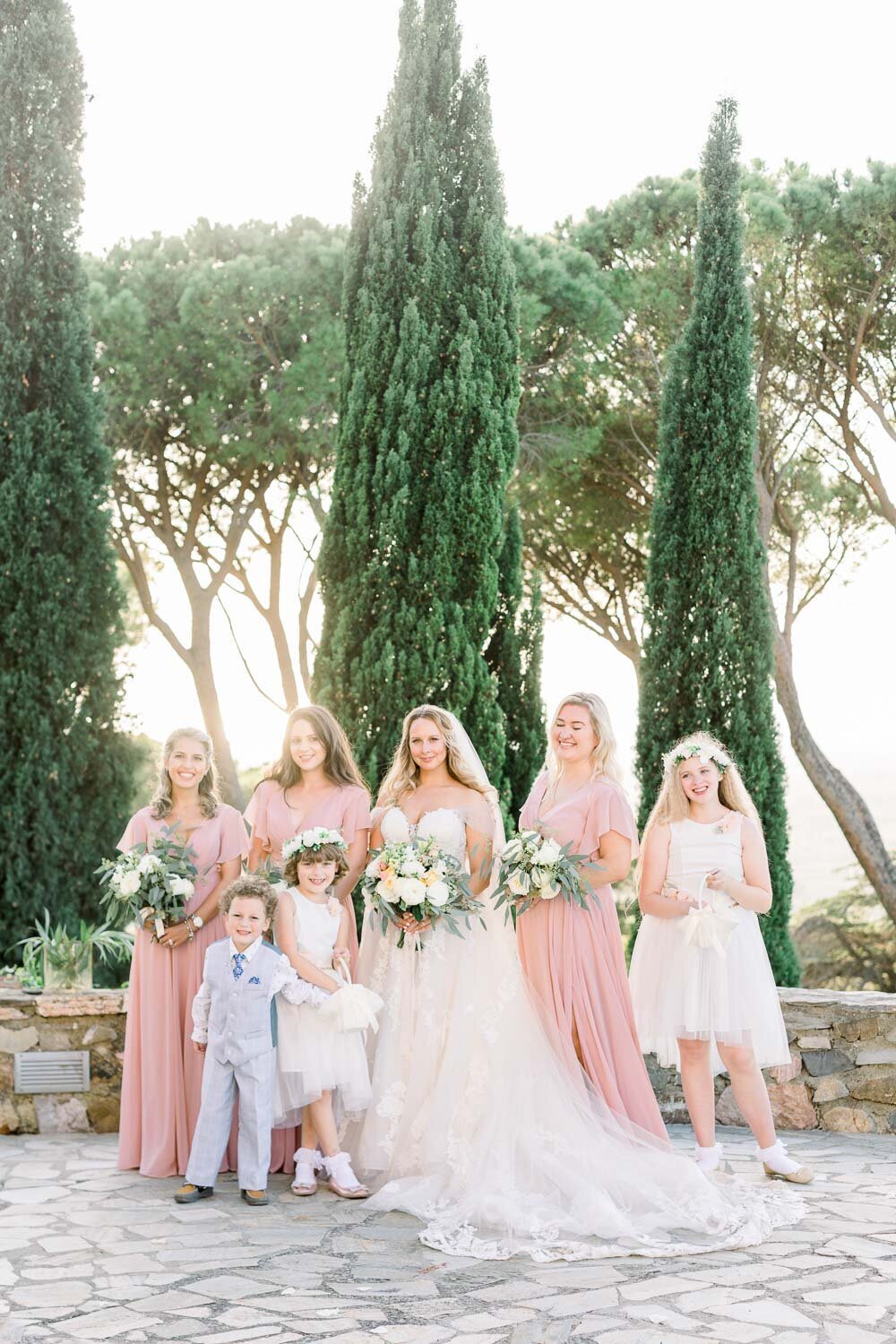 Bride and bridesmaids and kids during sunset portrait session
