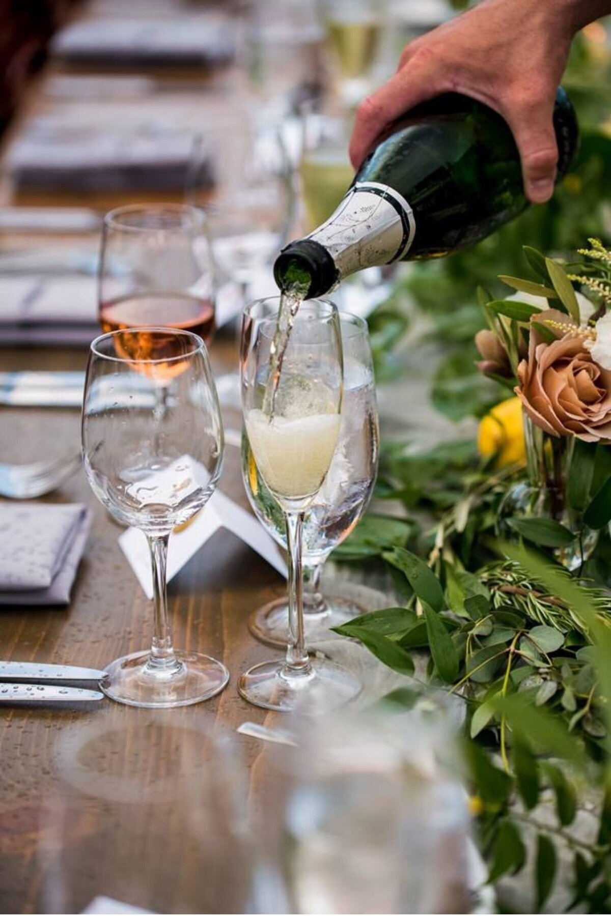 Champagne toast during dinner  on the terrace at a luxury Italian inspired Chicago North Shore wedding.