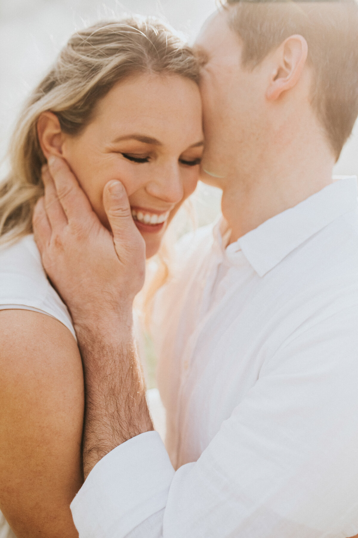Candid light and airy couples photo. Fun laughing and hugging. Melbourne Couples Photographer. Sapphire and Stone Photography