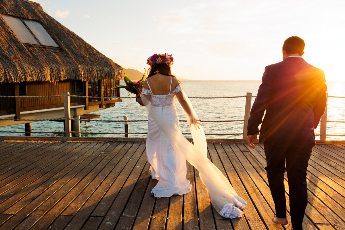 couple-on-dock-at-sunset-hilton-moorea-tahiti
