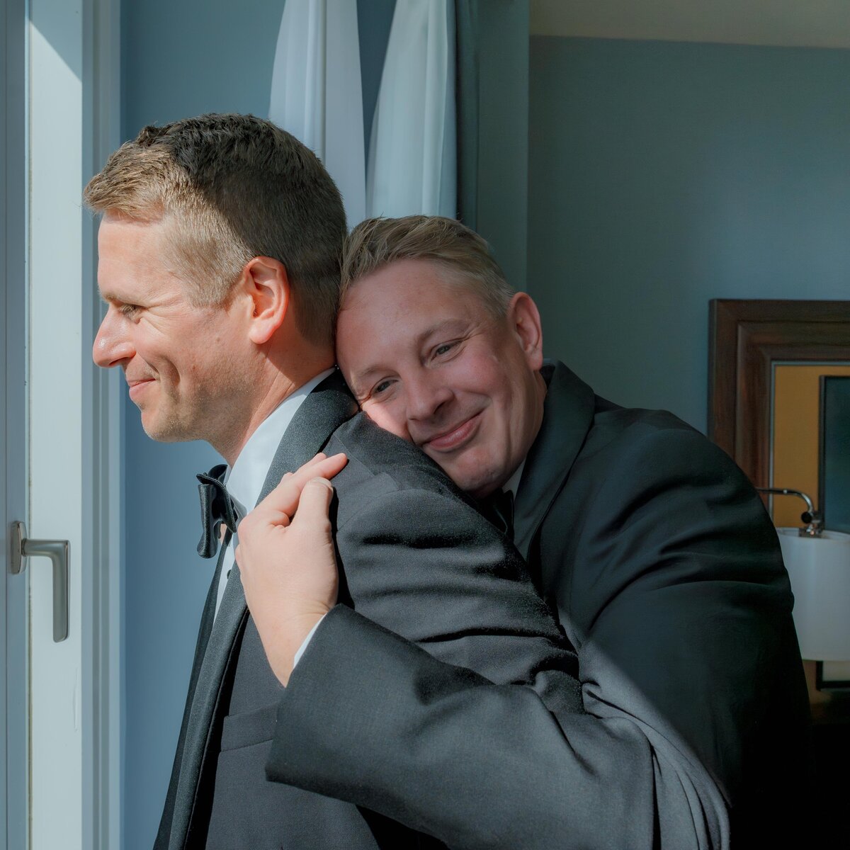 groom-and-best-man-hugging-wedding