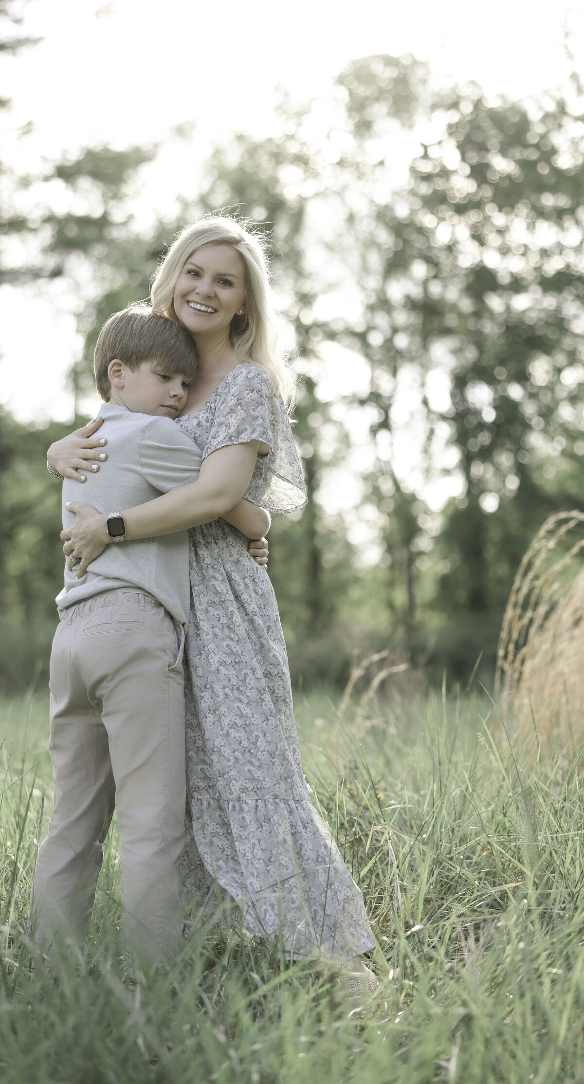 son giving his mother a hug on location Henderon Family Photography session