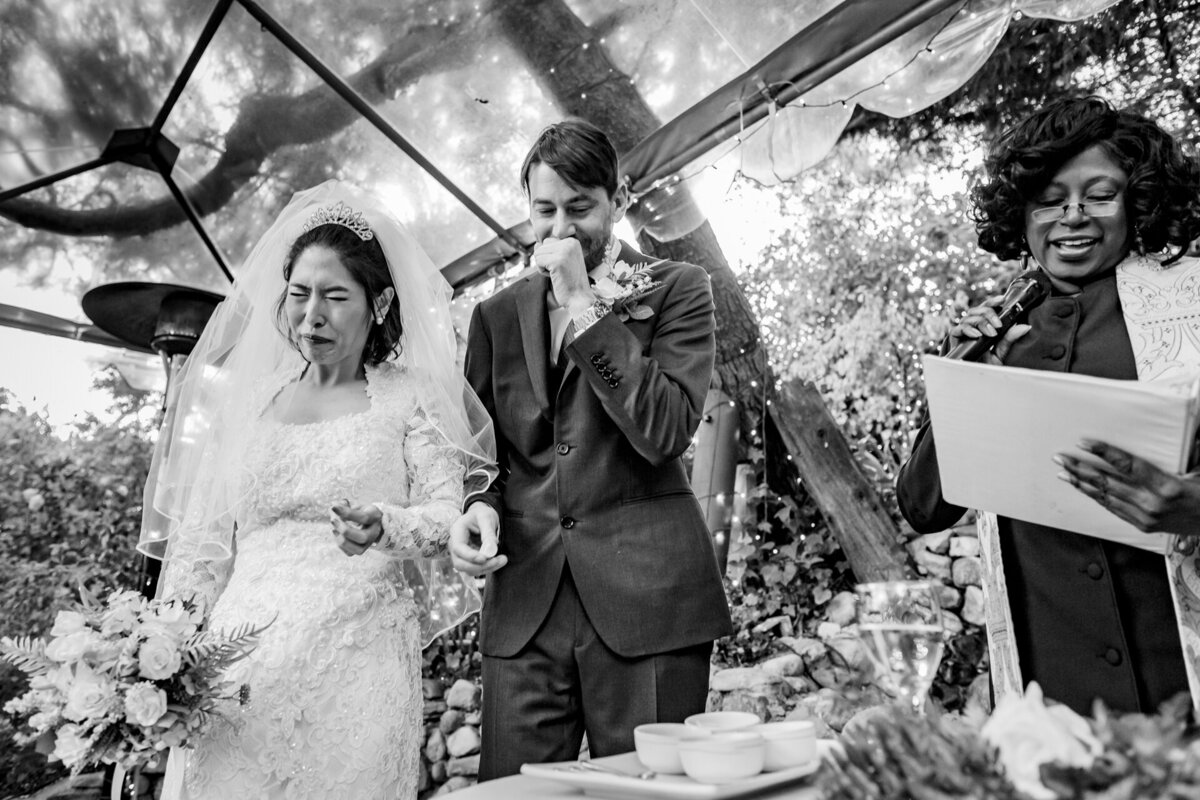 A bride and groom taste food during a ceremonial asian wedding tradition in Topanga Malibu country, photo by Tanya Parada