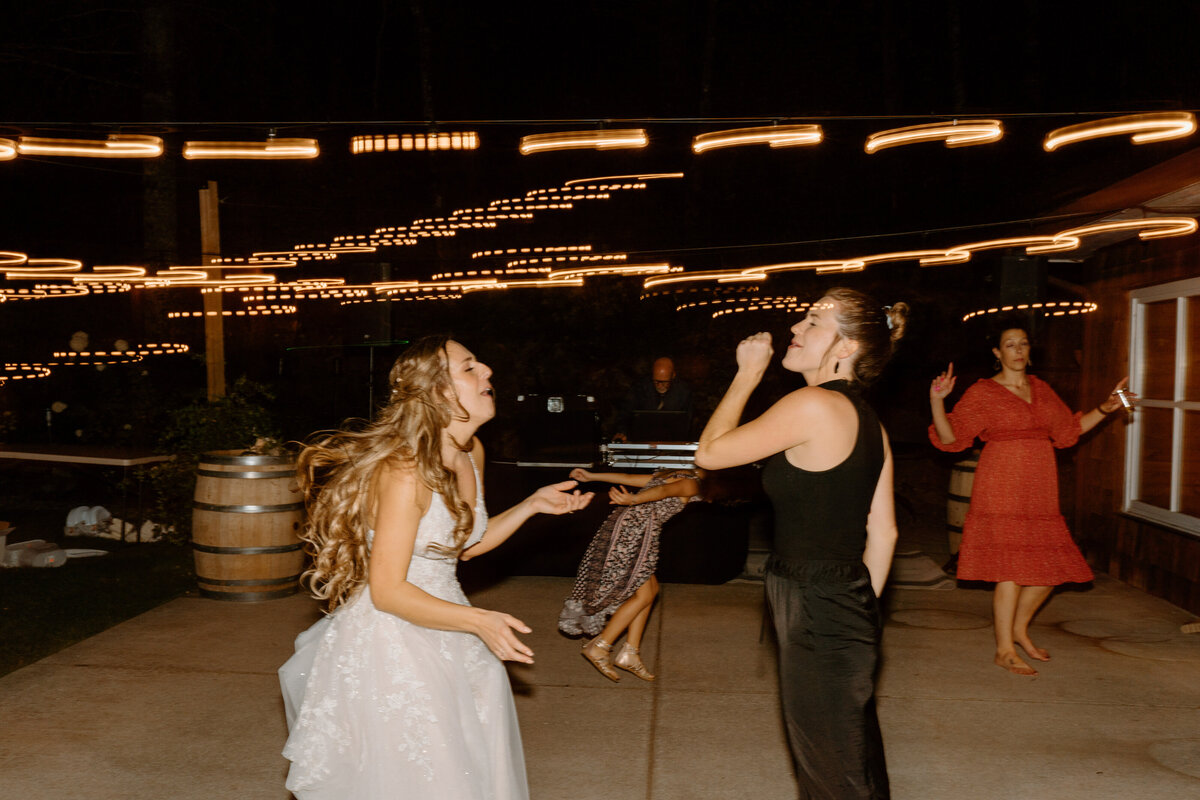 bride singing with photographer
