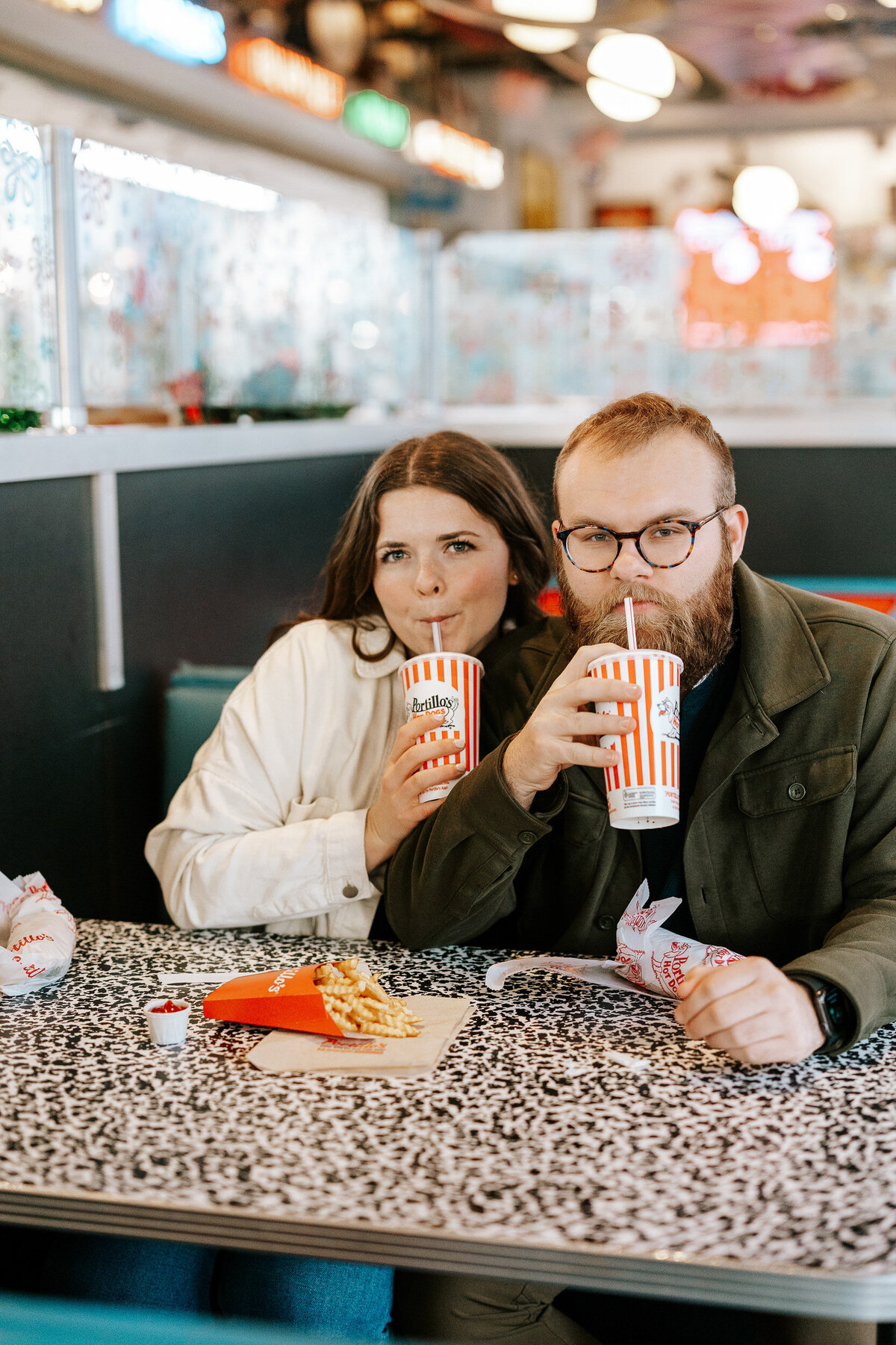 creative fun chicago flash engagement photos at Portillos Hotdogs-16-ed-lucy