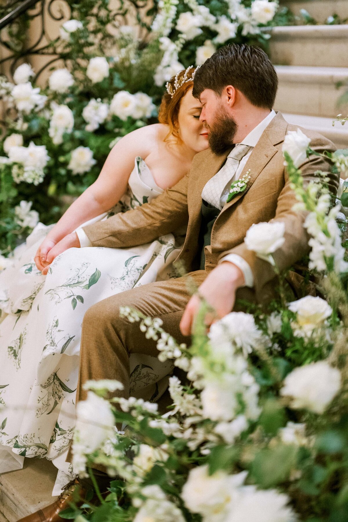 sweet-moment-bride-and-groom-surrounded-flowers