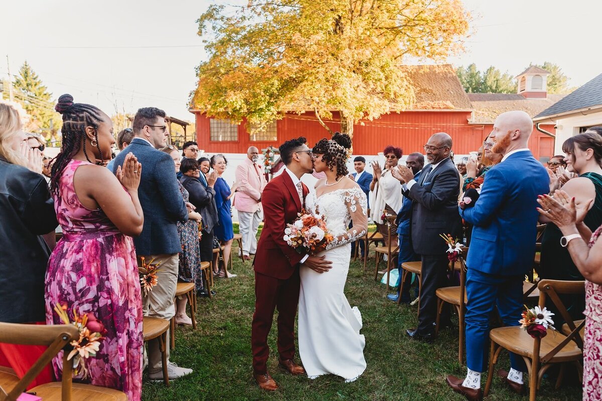 wedding couple kiss at wedding aisle