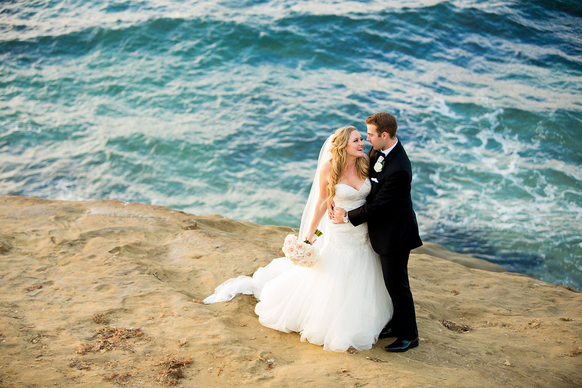 Bride and Groom Holding Each Other in La Jolla During La Valencia Wedding