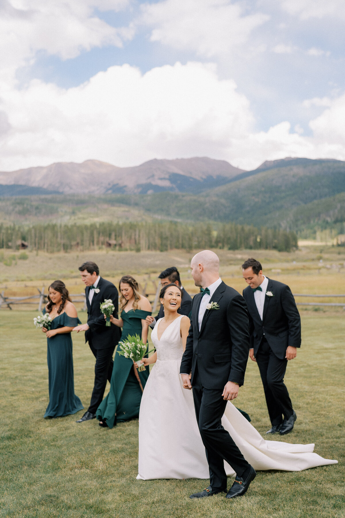 Bridal party walking in mountains in Colorado