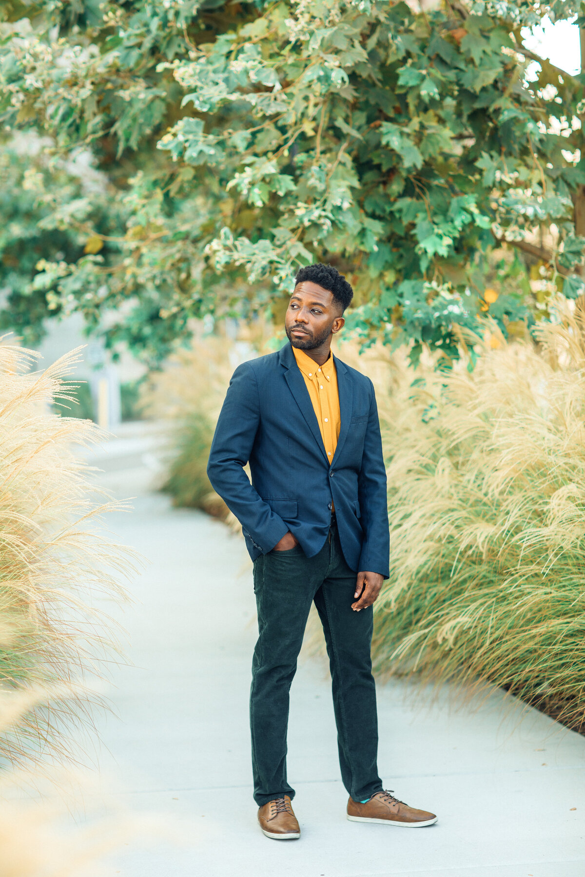 Portrait Photo Of Young Black Man In Yellow Polo Los Angeles