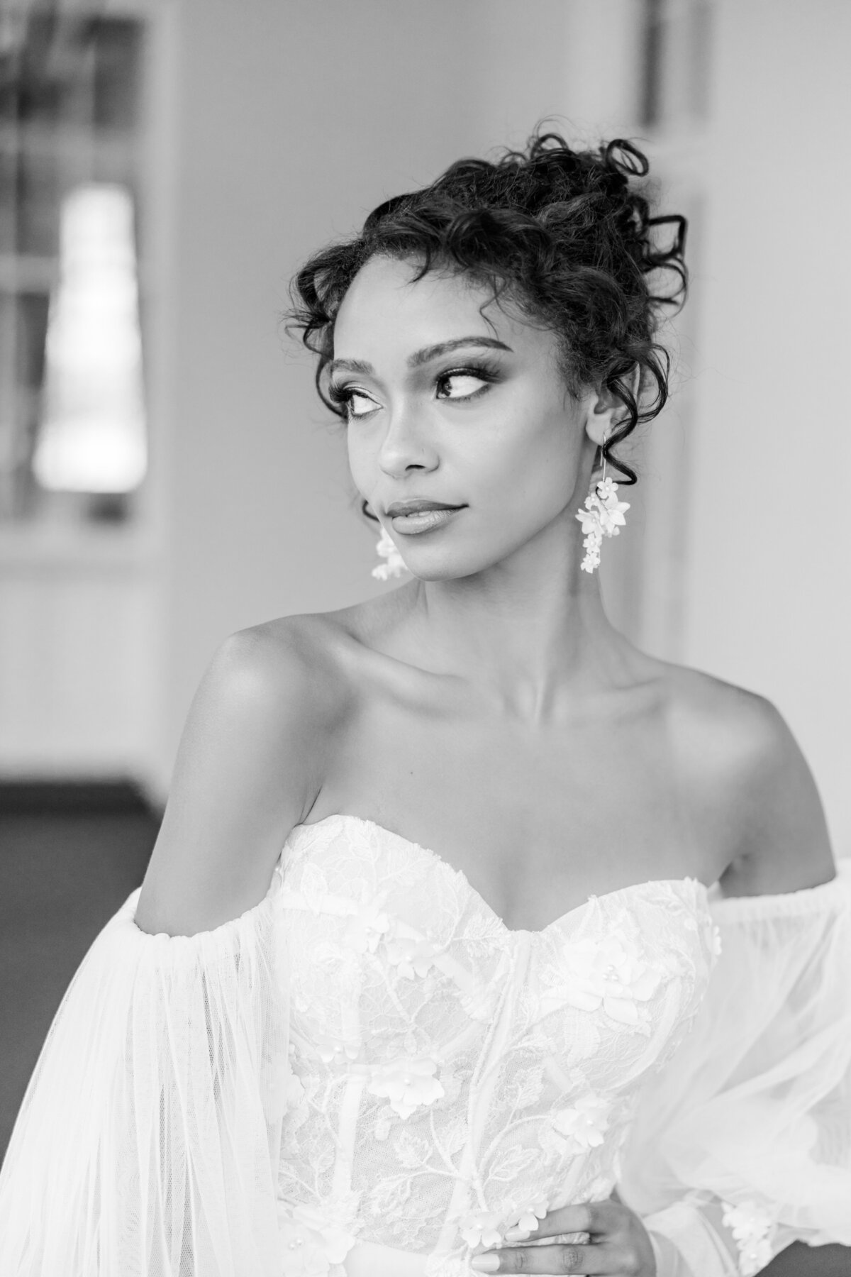 black and white portrait of a bride with an off the shoulder wedding dress, photographed at the William Aiken House by Tracy Waldrop Photography