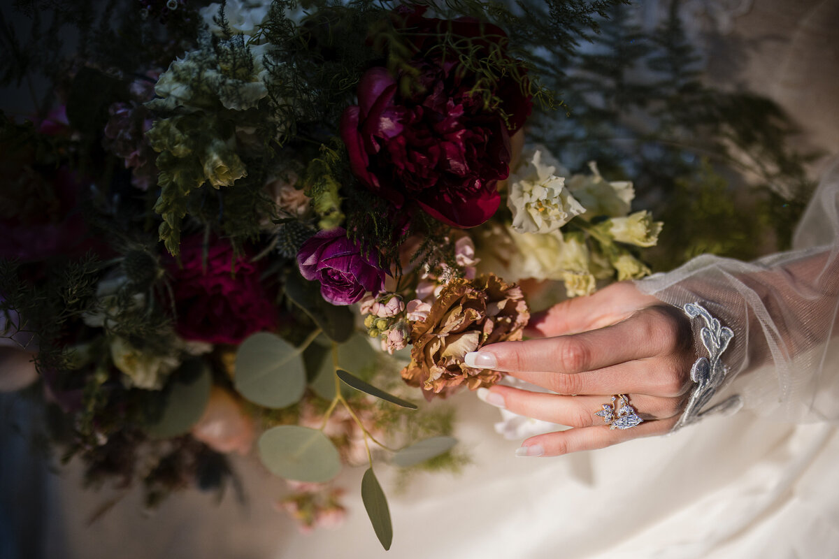 A bride holds her wedding bouquet at a destination wedding at Nestldown in Los Gatos, California