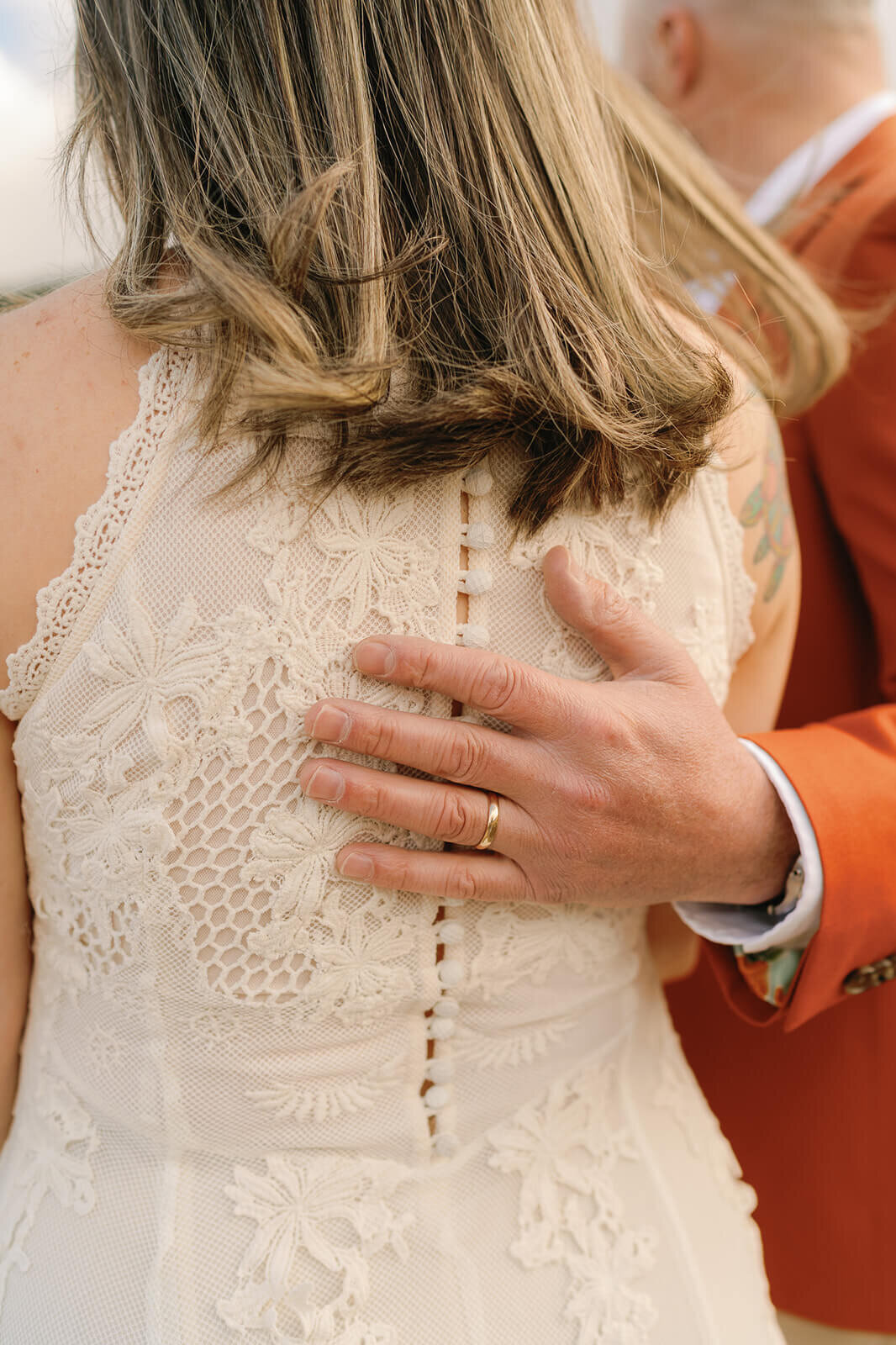 husbands ring on his wifes back