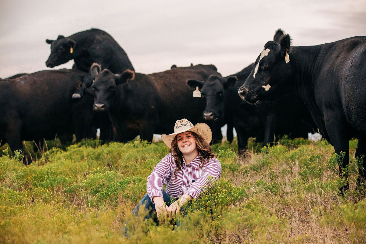 farm girl with cows in the background