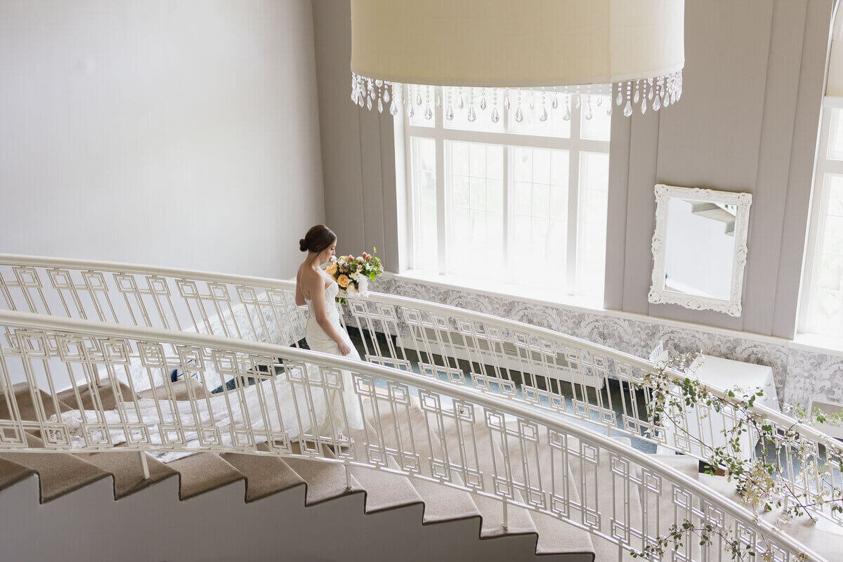 Bride on stairs planned by wedding planners chicago il