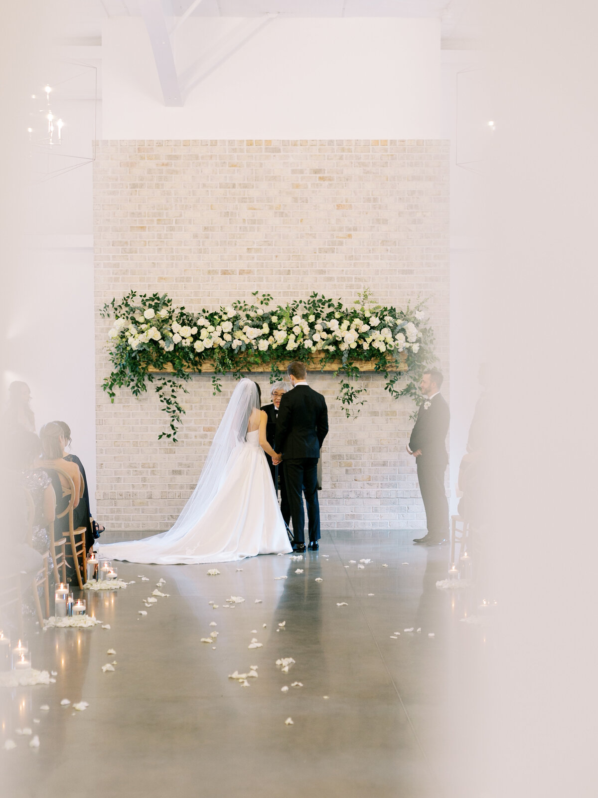 white and green  indoor ceremony at The Maxwell