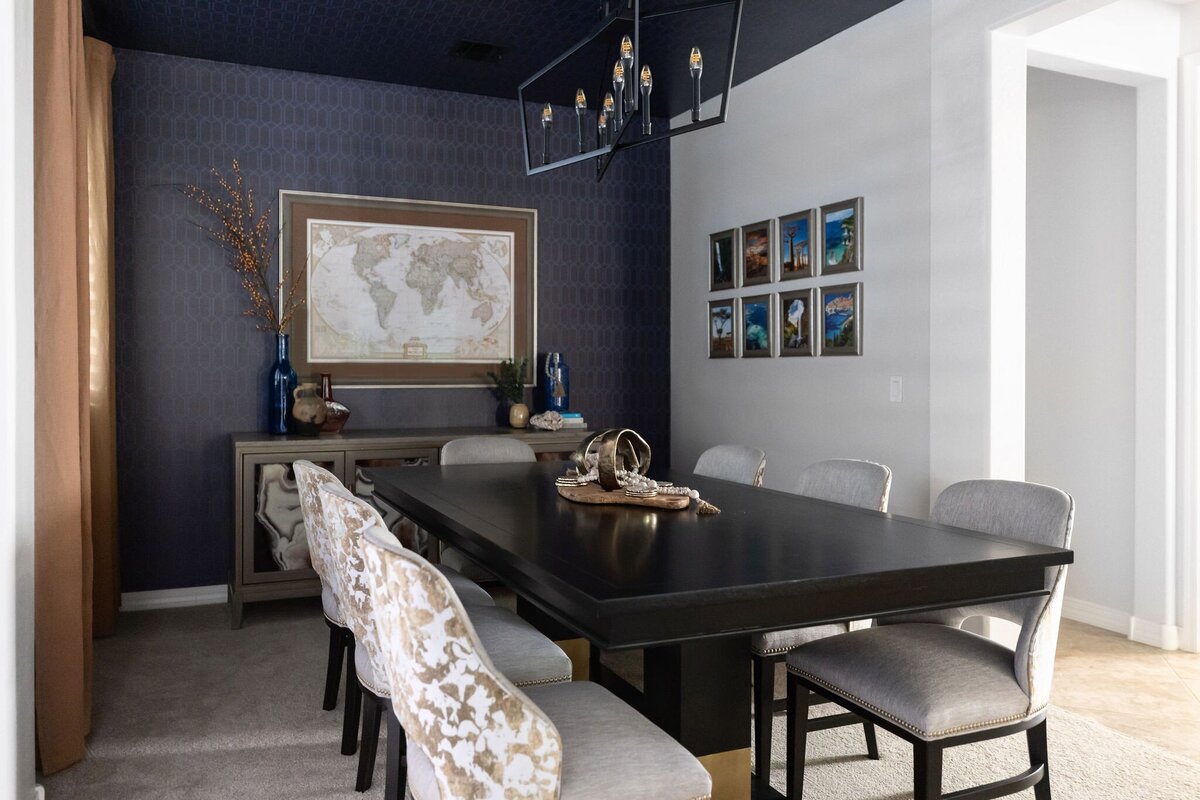 Moody dining room vignette with bar cabinet, modern art, and floral styling, designed for an upscale Phoenix home.