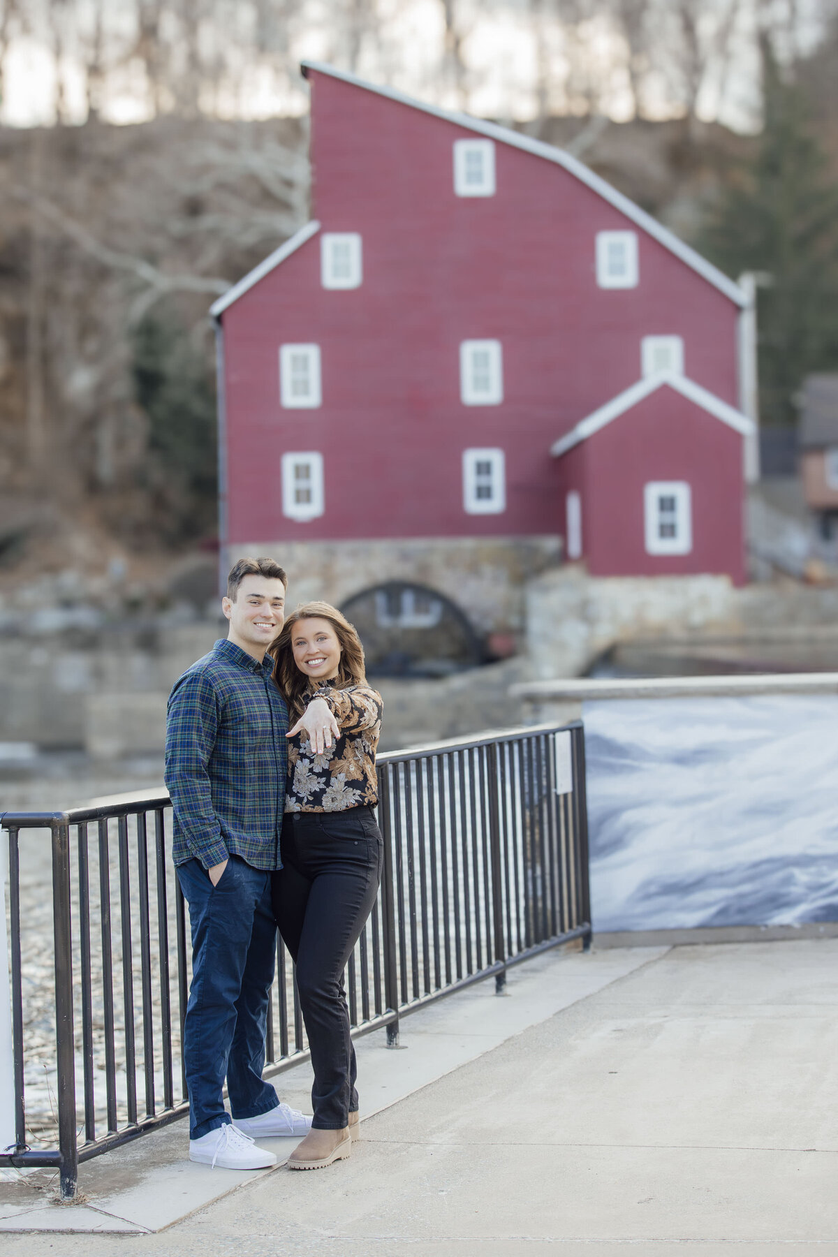 Proposal Photos | Groom-to-be proposing during fall surrounded by colorful leaves near the Red Mill Museum | Clinton, New Jersey