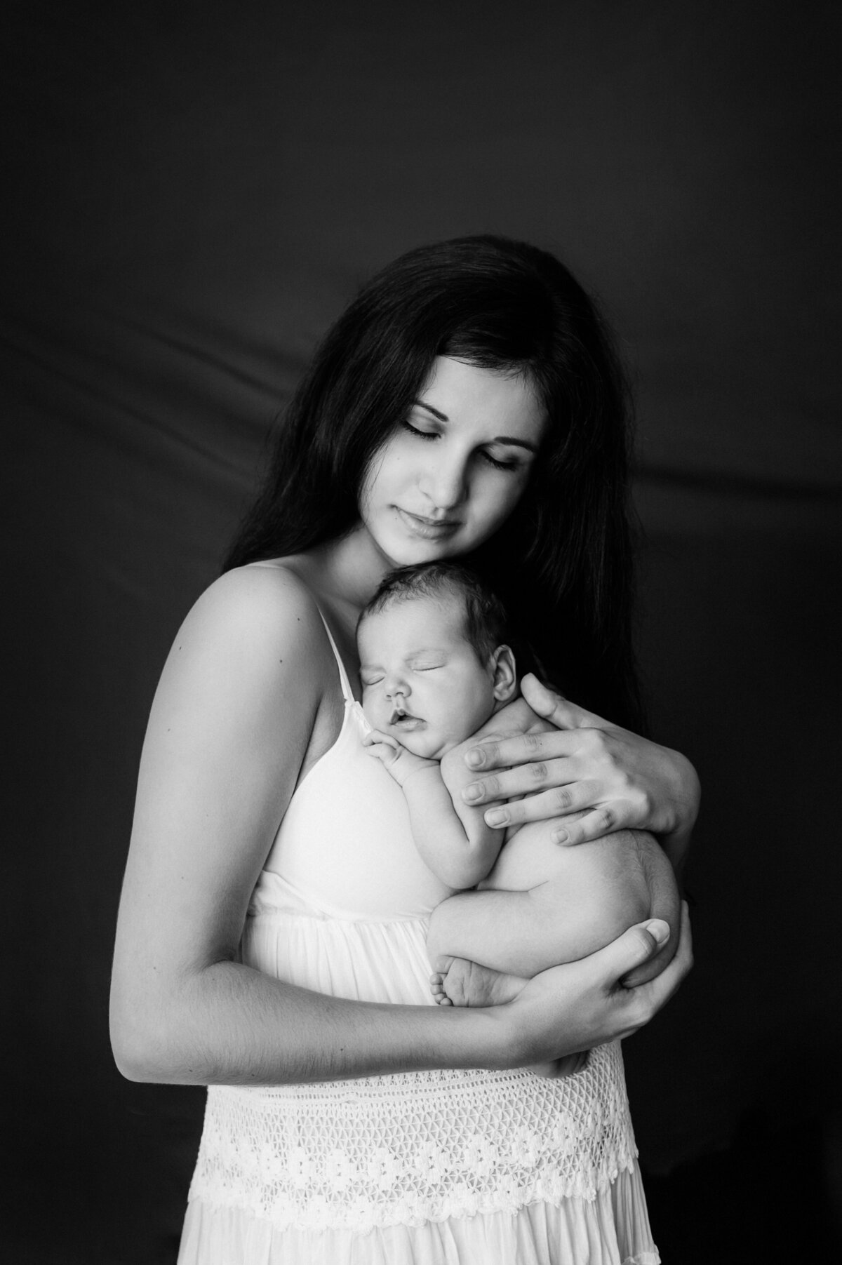 portrait-mother-daughter-against-black-background