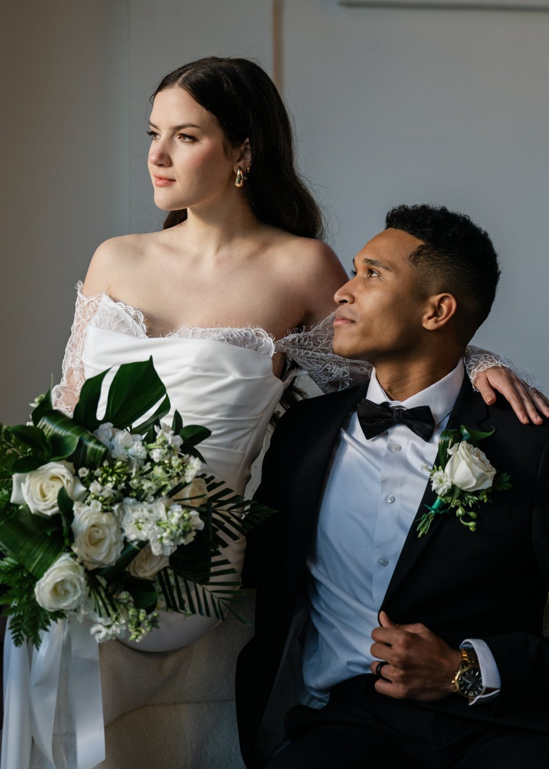 bride and groom seated indoor wedding reception pose