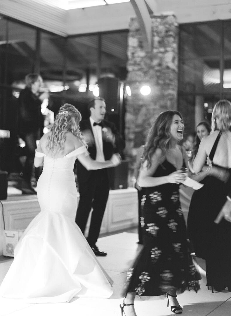 Black and White of Bride Groom and Guests Dancing Photo