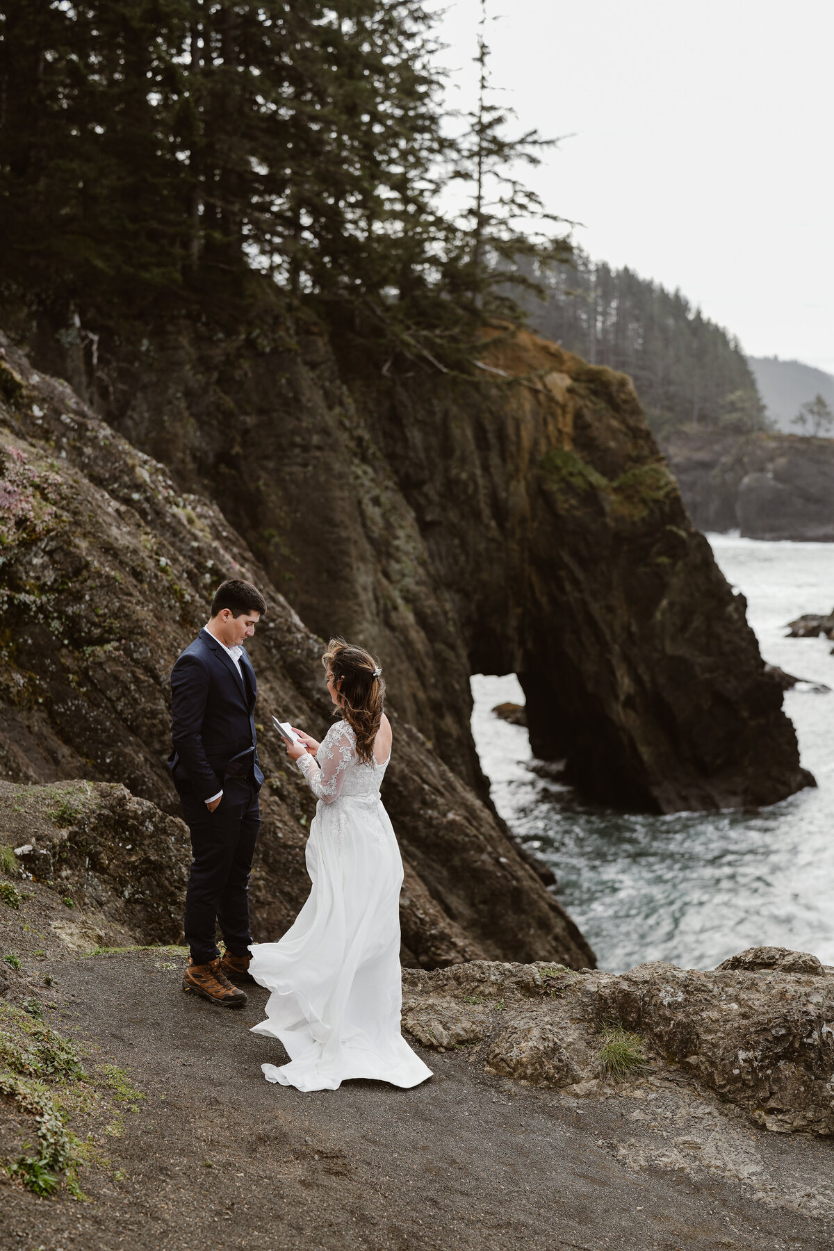 bride and groom on cliffside
