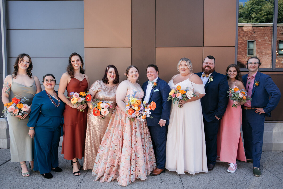 colorful wedding party with mismatching bridesmaid dresses