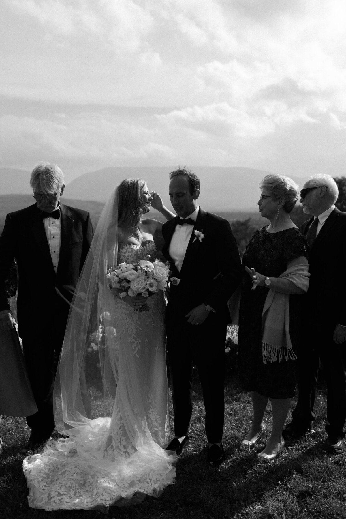 Wedding party stands together at the altar 