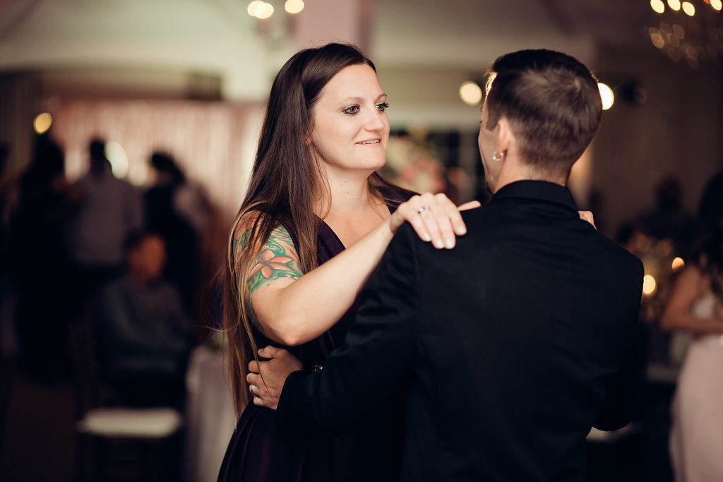 Wedding Photograph Of Woman In Black Dress Dancing With The Groom Los Angeles