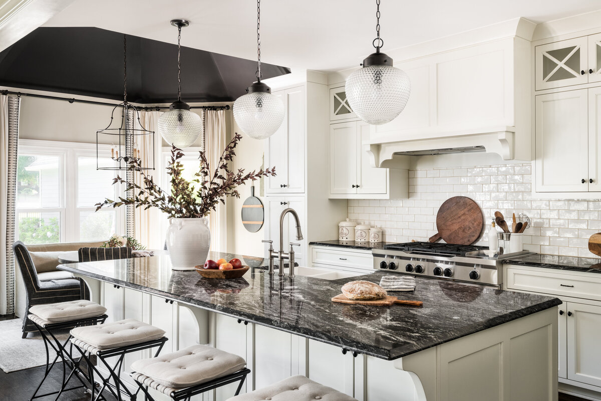Modern kitchen with custom cabinetry, statement lighting, and warm accents for a sophisticated, functional space.