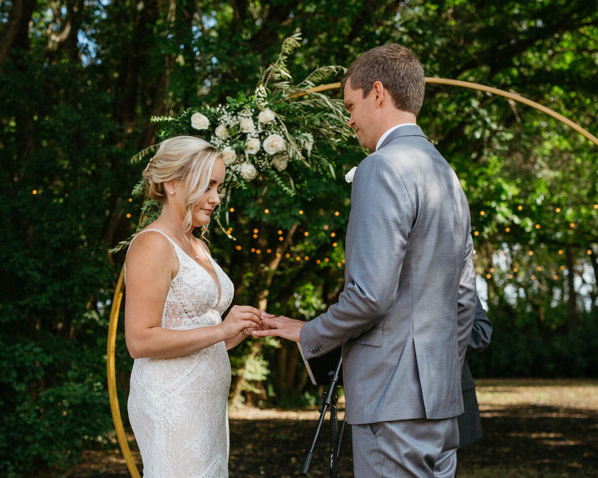 bride-putting-ring-on-groom