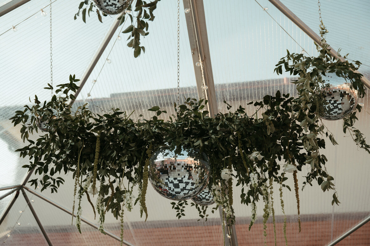 Emotional first dance moment for two grooms at an industrial wedding venue, planned by The Eventful Gals in Northeast Florida.