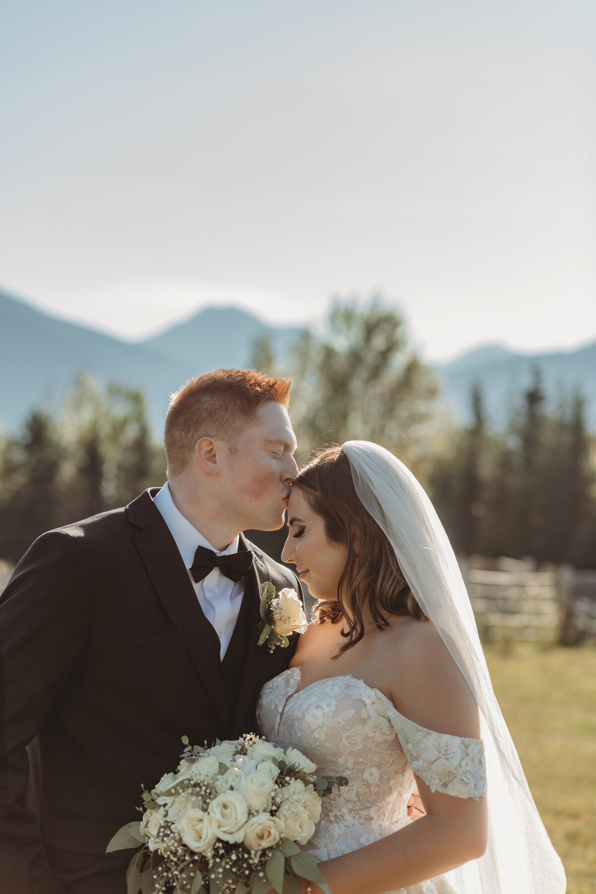 Newly married bride and groom in the rocky mountains