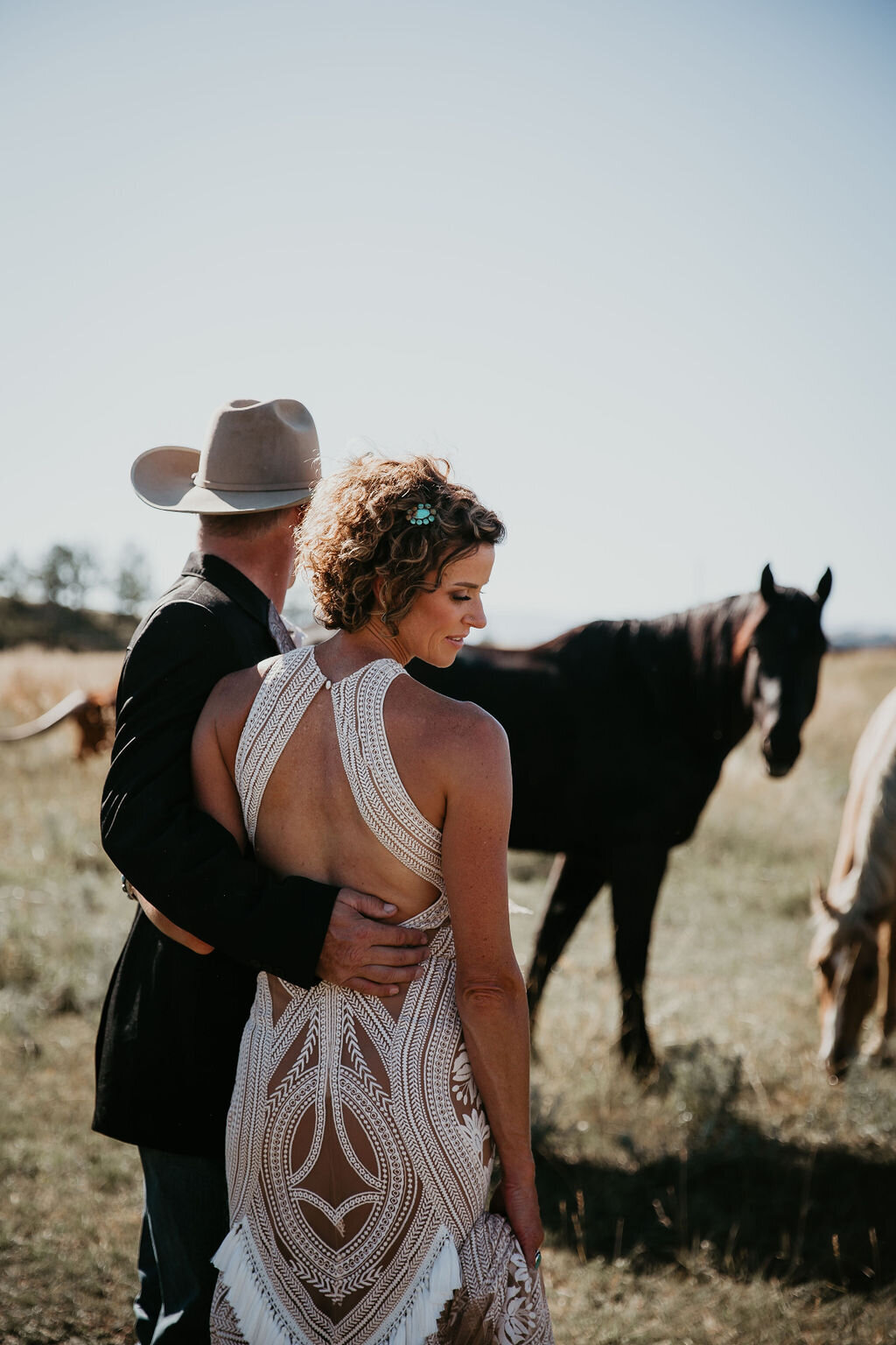 Bride and groom with horses