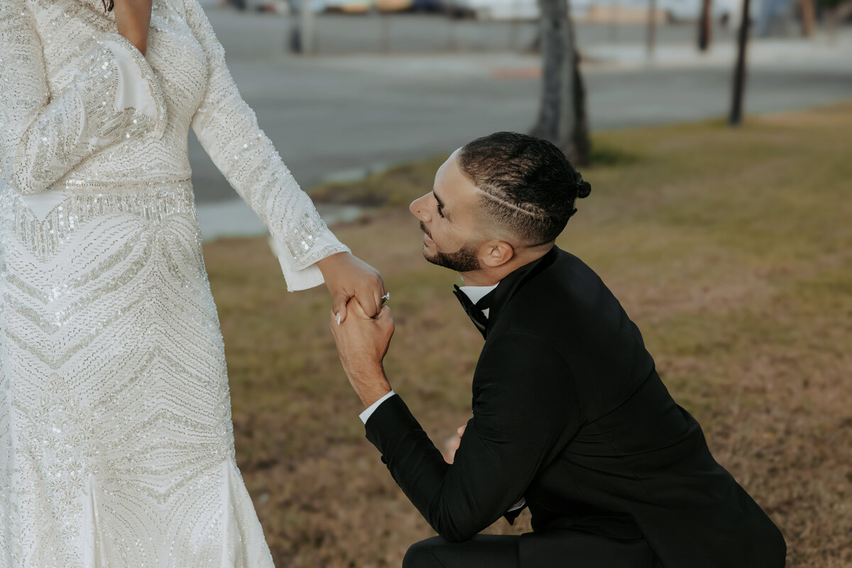 Arabian Wedding in Los Angeles – Groom Kneeling and Holding Bride’s Hand