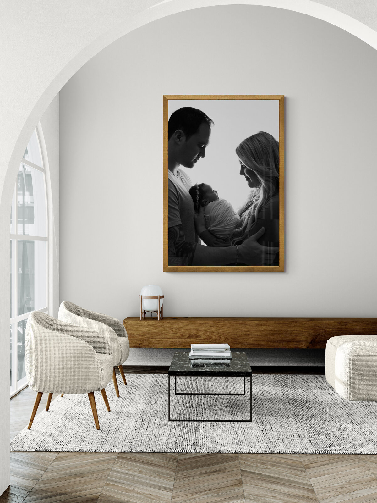 Luxury wall art 36" x 24" portrait from Atlanta newborn photography session of family of four smiling at camera with mom and dad facing each other holding baby in between.