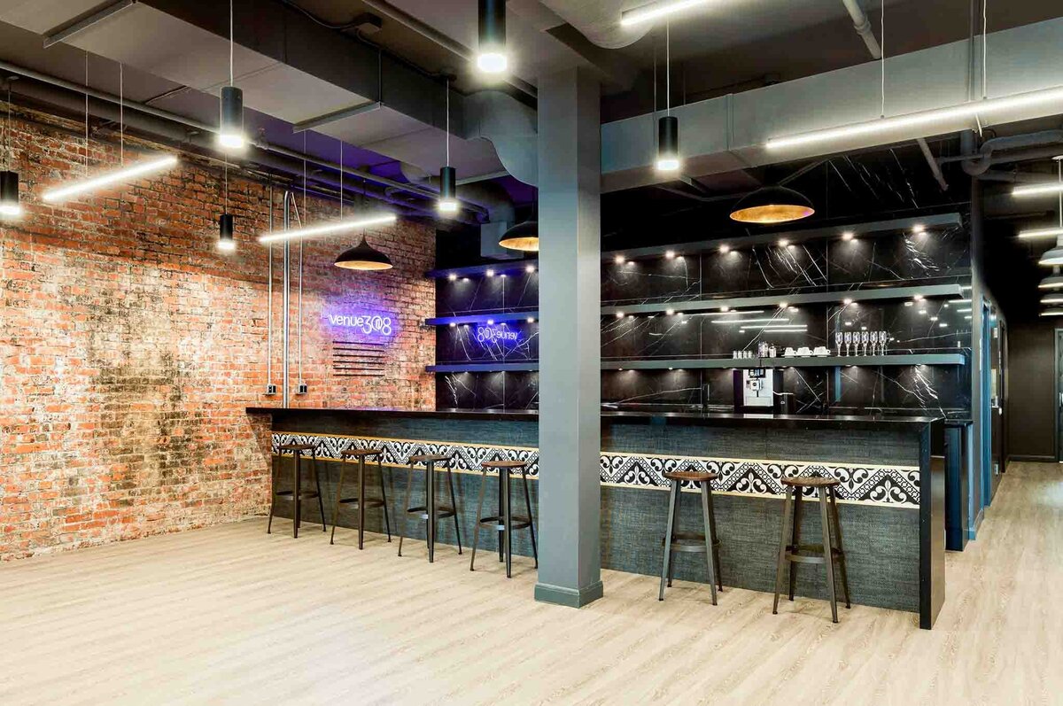 Trendy and modern bar area at Venue 308, a historical warehouse wedding venue in Calgary, featured on the Brontë Bride Vendor Guide.